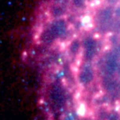 Supernova SN2003gd in July 2004 (1)
The dust factory, also known as supernova SN 2003gd, is shown at the center of the two small insets from Spitzer's infrared array camera. A white arrow points to its exact location. 
The yellow-green dot shown in the July 2004 inset (here) shows that the source's temperature is warmer than the surrounding material. This is because newly formed dust within the Supernova is just starting to cool. 
Parole chiave: From Space Images - SST