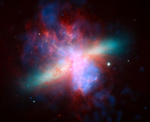 M 82: A "Space Rainbow"
Caption NASA originale:"NASA's Spitzer, Hubble and Chandra Space Observatories teamed up to create this multi-wavelength, false-colored view of the M82 galaxy. 
The lively portrait celebrates Hubble's "sweet sixteen" birthday. 

X-ray data recorded by Chandra appears in blue; infrared light recorded by Spitzer appears in red; Hubble's observations of hydrogen emission appear in orange, and the bluest visible light appears in yellow-green".
Parole chiave: From Space Images - Chandra X-Ray Space Telescope and SST