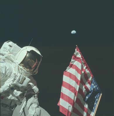 AS 17-134-20384 - The Man, The Flag, The Earth
EVA-1 at the LM. This is an excellent portrait of Jack with the U.S. flag and the Earth. We get a good view of Jack's chest-mounted RCU and the camera bracket. Using planetarium program Starry Night Deluxe, we see that, had cloud cover over the southwestern Pacific been lighter, the Antarctica would have been visible at the left and Australia would have been coming into view over the top. Four hours later, Earth's rotation would bring Australia to center stage.
Parole chiave: Postcards from the Moon