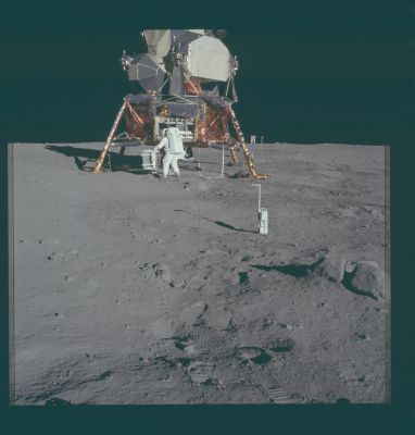 AS 11-40-5931 - "Buzz", Lunar Module & various Equipment
110:55:49 MT. In this second photo from Neil's minus-Z (East) pan, Buzz has removed the Passive Seismometer Package from the SEQ bay. The foreground object with the handle is the Gold Camera, designed to take close-up photographs of the very top layer of the Lunar Soil. Note, also, the split rock at the right edge, just below the center of the photograph. This boulder was probably ejected from a nearby impact, possibly West Crater, and broke into two pieces when it hit. A different boulder, just to the left of center near the tip of the LM shadow in 5883, appears to have suffered a similar fate.

Parole chiave: Lunar Module (LM) and Lunar Equipment