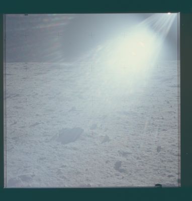 AS 11-40-5935 - Up-Sun (1)
110:55:49 MT. Rightward of 5934. Note the large boulders, presumably ejecta from West Crater, near the horizon on the left. The Northern part of East Crater can be seen in the Sun glare above center.
Parole chiave: Lunar Panorama - Apollo 11 Landing Site