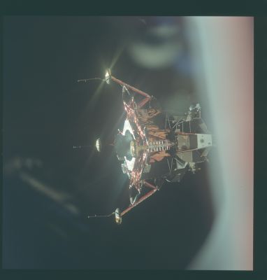 AS 11-44-6574 - The Eagle, after the undocking (1)
Caption NASA originale:"A view of the LM Eagle, shortly after undocking from CSM Columbia. At this point, Mike Collins is doing a visual inspection of the Lunar Module, and is verifying that the landing gear is down and locked.
An evolution in the LM's design is also apparent. The RCS plume deflectors, mounted on the Descent Stage underneath each RCS quad, were added to prevent the thermal damage observed on the Apollo 10 LM. 
Compare this photograph with that of the Apollo 10 LM ( AS10-34-5085 )".
Parole chiave: The Lunar Module (LM) in Space