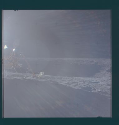 AS 12-47-6949 - LM and Surveyor Crater
Caption originale:"The appearance of both Surveyor III and the Surveyor Crater shadow has not changed noticeably in the three hours since Pete Conrad took his pans. 
This frame, leftward of 6948, shows the HTC (such as the "Hand Tool Carrier") and the RTG (meaning "Radioisotope Thermoelectric Generator") Fuel Cask. 
Surveyor III is just to the left of center".
Parole chiave: Lunar Surface - Landing Site Apollo 12 - Surveyor Crater