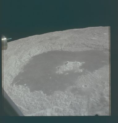 AS 15-87-11729 - Tsiolkovsky Crater
Caption NASA originale:"Dave took this picture of Tsiolkovsky on Rev. 14 from the LM when they were at an altitude of about 90 Km. 
This is the last image on the magazine taken prior to the landing".
Parole chiave: The Moon from orbit - Craters (Tsiolkovsky)