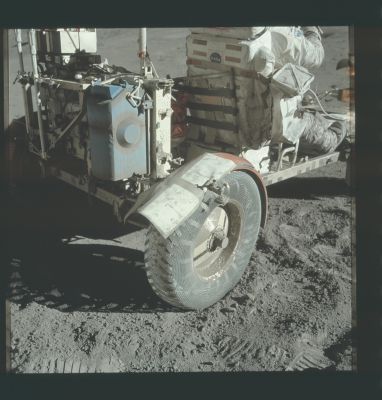 AS 17-137-20979 - Departure from Station 2
Picture of the replacement fender taken at about 143:46:34 MT by Cernan, just before driving off from Station 2. Schmitt is already seated. The dust-coated- originally-blue Traverse Gravimeter is mounted on the back of the LR, just above the replacement fender. Gene took this photo, in part, to document its condition after the 9,1 Km drive out from the LM and, in part, to document his handiwork. At the end of EVA-3 Gene decided to bring the fender back to Earth and, as of the late 90s, it was still on display at the National Air & Space Museum in Washington D.C.
Parole chiave: Lunar Rover