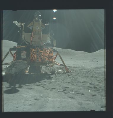 AS 17-140-21371 - The Lunar Module
Caption NASA originale:"Frame from Jack's EVA-3 pan. Up-Sun photo of the LM ladder, the hatch, the MESA to the left of the ladder, the LRV deployment hardware to the right, and the SEP pallet against the leftmost (north) strut. Note the jettison bags under the LM at the right edge of the frame". 
Parole chiave: The Lunar Module (LM)