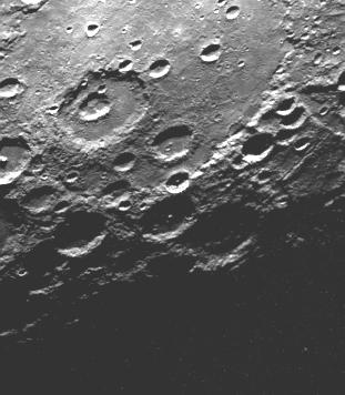 Craters on the morning terminator...
Caption NASA originale:"As Mariner 10 passed by Mercury on its second encounter with the planet on September 21, 1974, this picture (FDS 166850) of a large circular (350 Km - or 220 mile diameter) basin was obtained near the morning terminator. The basin appears to have been flooded with the plain material and then subsequently cratered by numerous large events. Filling of the basin, presumably by lava flows analogous to those of the lunar maria, partially inundated small craters which had formed along the basin rim (lower left) and in some places overflowed the basin rim and spilled onto the surrounding terrain (top)".
Parole chiave: Mercury