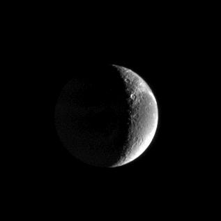 Streaks on Dione
Caption NASA originale:"Wispy streaks curl over the horizon on Saturn's moon Dione, caught here in a distant view from Cassini. The streaks were first revealed by NASA's Voyager spacecraft and subsequently were shown by Cassini to be an immense system of linear fractures in the moon's surface. The image was taken with the Cassini spacecraft narrow-angle camera using a filter sensitive to wavelengths of ultraviolet light centered at 338 nnmts. The image was acquired on Feb. 18, 2005, at a distance of approximately 1,3 MKM from Dione and at a phase angle of 118°. The image scale is 8 Km per pixel".
Parole chiave: Saturn's Moons - Dione