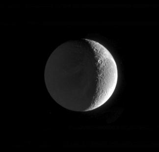 Saturnshine
Caption NASA originale:"This Cassini image shows the night side of Saturn's moon Dione, dimly lit by "Saturnshine": that is, reflected light from the planet lying off to the left in Cassini's field of view when this image was taken. 
The image was taken in visible green light with the Cassini spacecraft narrow-angle camera on Feb. 18, 2005, at a distance of about 1,3 MKM (approx. 808.000 miles) from Dione and at a phase angle of 118°. The image scale is 8 Km (approx. 5 miles) per pixel". 
Parole chiave: Saturn's Moons - Dione