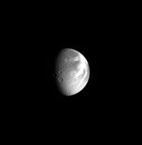 Dione unmagnified
Caption NASA originale:"This unmagnified view of Saturn's moon Dione shows the moon's bright, wispy terrain, along with several large impact craters. Two of the craters have central peaks. North on Dione is up. 
This view shows principally the anti-Saturn hemisphere on Dione. 
It is now clear why low-resolution NASA Voyager spacecraft images gave the impression that the Dionian wispy terrain might be bright ice deposits: HR Cassini images have shown these to be complex systems of braided (to braid--->intrecciare) tectonic fractures. 
The image was taken in visible light with the Cassini spacecraft narrow-angle camera on April 25, 2005, at a distance of approx. 2,8 MKM (such as approx 1,7 MMs) from Dione and at a phase angle of 60°. 
The image scale is 17 Km (approx. 11 miles) per pixel".
Parole chiave: Saturn's Moons - Dione