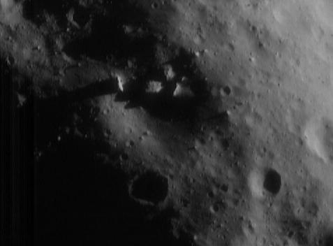 Eros' Boulders
NEAR Shoemaker images have shown many large boulders on Eros' surface, but seldom are the boulders as big and as close as the ones in this image taken on June 20, 2000, from an altitude of 51 Km. Nestled within the 700-meter (2300-foot) diameter crater at the center of the picture are four particularly large rocks whose tops protrude out from the shadowed crater interior and into sunlight. The center boulder, the largest, is about 100 meters (330 feet) across. The whole scene is approximately 1.9 Km across.
Parole chiave: Asteroids: images from Space