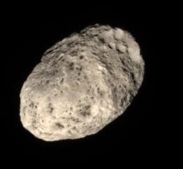 Pink Hyperion...
Caption NASA originale:"Unlike most of the dull grey moons in the Solar System, Hyperion's color is a rosy tan (---> Light Pink), as this view shows. 

The origin of the moon's unusual hue is not known. Some scientists suspect the color comes from falling debris from moons further out. 
A similar origin has been suggested for the dark reddish material on Saturn's moon Iapetus. 

Images taken using red, green and blue spectral filters were combined to create this natural color view. The images were taken in visible light with the Cassini spacecraft narrow-angle camera on June 28, 2006 at a distance of approx. 291.000 Km (about 181.000 miles) from Hyperion. Image scale is roughly 2 Km (a little more than 1 mile) per pixel".
Parole chiave: Saturn's Moons - Hyperion