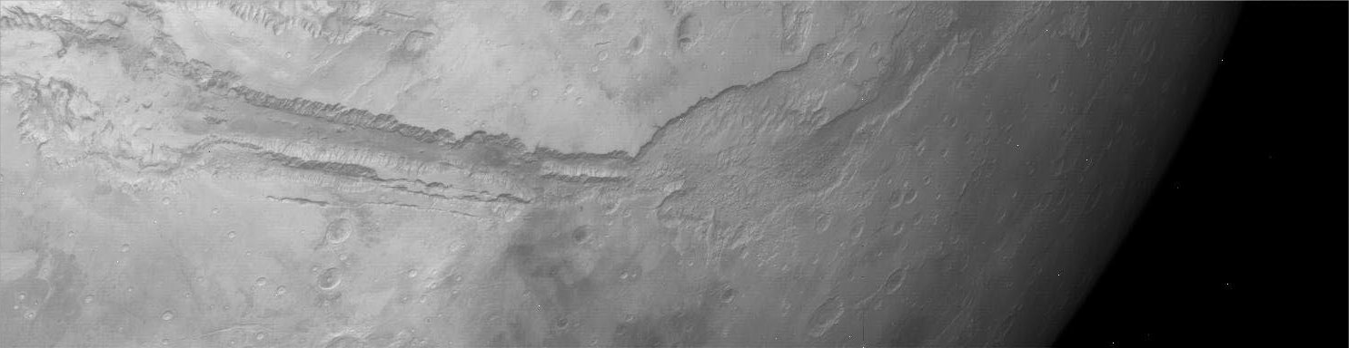 The "Strange Days" of Phobos-2: in Mars' orbit (2)
The last successful Soviet space probe, Phobos-2, arrived in Martian orbit on January 30, 1989. It carried an optical-mechanical linear camera that operated simultaneously in red/near-infrared light (600 - 950 nnmts) and far thermal infrared (8,5 - 12 ì), using a cryogenically cooled detector. Four pairs of panoramas were received. 
The elongated horizontal smudge seen in some images is the shadow of Phobos, traveling in nearly the same orbit as the spacecraft.
Parole chiave: Mars from orbit - Valles Marineris