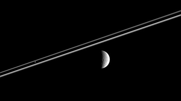 Rhea and Pandora
Caption NASA originale:"Distant Rhea poses here for the Cassini, as Pandora hovers against Saturn's dark shadow on the Rings.

This image was taken in visible light with the Cassini spacecraft narrow-angle camera on Feb. 12, 2006, at a distance of approx. 3,6 MKM (2,3 MMs) from Pandora and 4,3 MKM (2,7 MMs) from Rhea. The image scale is 26 Km (about 16 miles) per pixel on Rhea".
Parole chiave: Saturn's Moons - Rhea and Pandora