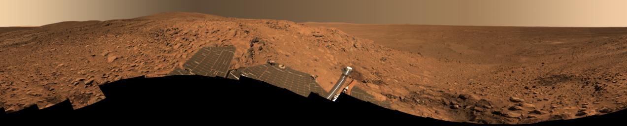 "Cahokia" Panorama - The "Columbia Hills" - Soles 213 - 223 (Approximate True Colors; credits: NASA/JPL/Cornell)
This stunning image mosaic of the "Columbia Hills" is the first 360-degree panorama taken since the Mars Exploration Rover Spirit arrived at the hills over a month ago. The rover has been busy studying the rocks here, which show evidence of past alteration by water. The dark patch of soil to the right is the spot where Spirit stopped for engineering work on its right front wheel. Spirit's tracks can be followed from there all the way back to "Bonneville Crater" and the original landing site, more than 3 kilometers (1.86 miles) away.

This approximate true-color image, nicknamed the "Cahokia Panorama" after the Native American archaeological site near St. Louis, was acquired between Sol 213 to 223 (such as Aug. 9 to 19, 2004). The panorama consists of 470 images acquired through six panoramic camera filters (750 to 480 nanometers). It took until the week of sol 237 (Sept. 2) to downlink all the data back to Earth. Several more weeks of image processing and geometric mapping by team members at Jet Propulsion Laboratory, Pasadena, Calif., and Cornell University, Ithaca, N.Y., were required to stitch all the images together into this spectacular mosaic.
Parole chiave: Mars Panorama