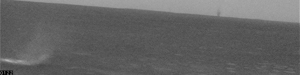 Dust Devils near Spirit on Sol 468
Caption NASA originale:"This picture shows a large, distant Dust Devil as a dark shape on the horizon near the right side of the image. This Dust Devil was about 5 Km (approx. 3 miles) away from NASA's Mars Exploration Rover Spirit and may have been up to 200 mt in diameter. 
Smaller Dust Devils closer to the Rover appear bright against the dark ground. Spirit's NavCam took these images on the Rover's 468th Sol (April 27, 2005)".
Parole chiave: Dust Devil