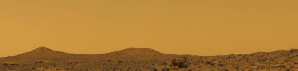 Twin Peaks - Sol 10 (True Colors; credits: NASA/JPL)
Caption NASA:"The True Colors of Mars based upon three filters with the sky set to aluminance of 60. The color of the Pathfinder Landing Site is yellowish brown with only subtle variations. These colors are identical to the measured colors of the Viking Landing Sites reported by Huck et al. [1977]. This image was taken near local noon (12:00 M.L.T.) on Sol 10. A description of the techniques used to generate this color image from IMP data can be found in Maki et al., 1999".
Parole chiave: Postcards from Mars
