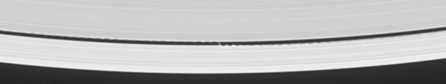 S/2005 S1: The "Wave-Maker" (2)
Caption NASA originale:"In the vicinity of the newly discovered little moon, the Keeler Gap's edges bear striking similarities to the scalloped edges of the 322 Km-wide (approx. 200-mile) Encke Gap, where the small moon Pan (25 Km, or approx. 16 miles across) resides. 
From the size of the waves seen in the scalloped edges of the Encke Gap, imaging scientists were able to estimate the mass of Pan. 
They expect to do the same, eventually, with S/2005 S1".
Parole chiave: Saturn's Moons - the "Wave-Makers"