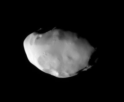 Telesto
These views show surface features and color variation on the Trojan moon Telesto. The smooth surface of this moon suggests that, like Pandora, it is covered with a mantle of fine, dust-sized icy material. 
This monochrome image was taken in visible light. To create the false-color view (see PIA07697), ultraviolet, green and infrared images were combined into a single black and white picture that isolates and maps regional color differences. 
The "color map" was then superposed over a clear-filter image. The origin of the color differences is not yet understood, but may be caused by subtle differences in the surface composition or the sizes of grains making up the icy soil. 
Tiny Telesto is a mere 24 Km (about 15 miles) wide. 

The image was acquired with the Cassini spacecraft narrow-angle camera on Dec. 25, 2005 at a distance of approx. 20.000 Km (about 12.000 miles) from Telesto and at a Sun-Telesto-spacecraft, or phase, angle of 58°. Image scale is 118 meters (387 feet) per pixel.
Parole chiave: Saturn's Moons - Telesto