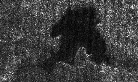 Titanian Northern Lakes (5)
Caption NASA originale:"This lake is part of a larger image taken by the Cassini radar instrument during a flyby of Saturn's moon Titan on Sept. 23, 2006. 
It shows clear shorelines that are reminiscent of terrestrial lakes. With Titan's colder temperatures and hydrocarbon-rich atmosphere, however, the lake likely contain a combination of methane and ethane, not water. 

Centered near 74° North Latitude and 65° West Longitude, this lake is roughly 20 by 25 Km (about 12 to 16 miles) across. It features several narrow or angular bays, including a broad peninsula that on Earth would be evidence that the surrounding terrain is higher and confines the liquid. Broader bays, such as the one seen at right, might result when the terrain is gentler, as for example on a beach".
Parole chiave: Saturn's Moons - Titan