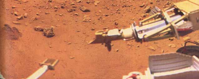 Color snap-shots from Viking 1 (3)
"...The scene has a reddish or orangeish cast. Figure (2) is constructed by incorporating data from an accompanying IR picture and using the spacecraft's test charts, in this way accounting for out of band contributions and atmospheric colorations. 
The scene is shown as it might appear "on Earth". For example, if you could pick up one of the boulders and transport it to your back yard, this is the color you would observe. Note that, relative to figure (1), the reddish tint is subdued, replaced with a brown hue. 
Figure (3) shows the scene as it would appear "on Mars". The yellowish cast of Sunlight filtering through the atmospheric dust imparts a similar yellowish hue to the entire scene".
Parole chiave: Martian Surface - natural colors?