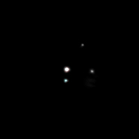 New "moons" for Pluto? Early news (first picture at LR)
Two small moons have been discovered orbiting Pluto, bringing the Planet's retinue of known satellites to 3 and leaving scientist to wonder how it could be. 
The newfound moons orbit about 27.000 miles (44.000 Km) from Pluto, more than twice as far as Charon, Pluto's other satellite, and they are 5000 times dimmer than Charon.
Preliminary observations suggest they are in circular orbits around Pluto and in the same plane as Charon, said Hal Weaver of the Johns Hopkins Applied Physics Laboratory.
"That suggests they probably formed at the same time as Charon" Weaver told SPACE.com in a telephone interview. NASA planned a teleconference with reporters to announce the discovery.
While scientists had predicted there might be more moons, the newfound setup is surprising nonetheless, in part because Pluto is smaller than our own Moon.

"It's almost like a mini Solar System" Weaver said. 
How can something about 70% the size of Earth's Moon have all these satellites? How can that happen?".
Parole chiave: Pluto's System