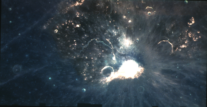 Aristarchus: the TLPs "Hottest Spot" (1)
A mosaic of more than 250 images showing the complex and diverse Aristarchus Region of the Moon in approximately "natural" colors (blue = 415 nanometers, green = 750 nanometers, red = 950 nanometers). The plateau is an uplifted block of complex, highland terrain, partly flooded by later mare basalt lavas. Dark, pyroclastic glasses partly cover the uplifted terrain. The crater Aristarchus (47 Km in diameter) has formed in the South-Western corner of the Plateau, excavating both highlands and mare rocks." 
Parole chiave: The Moon from Clementine