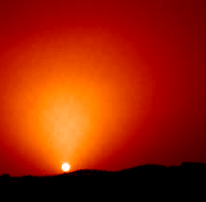 The "True Colors" of Mars (21)
"...problemi per guadagnare tempo, quella circostanza appare per quello che è e cioè una gigantesca "sola". Dalle foto HST e da quelle Mariner scampate al cover-up sappiamo invece che l'aspetto di Marte era molto più complesso ed inquietante del previsto e andava diffuso col contagocce, cosa che in effetti si fece.
I colori tornarono in ballo col Viking e me lo ricordo bene. Subito dopo il landing del 1976 vennero diffuse ai media delle immagini di Marte con un bel cielo blu ed un terreno molto "terrestre". Dopo 48 ore passate a rispondere al telefono ad Americani preoccupati, la NASA cominciò a tingere di rosso le foto e da allora non si è più fermata. Altra piccola considerazione: possibile che nessuno si sia accorto che di sabbia asciutta non ce n'è proprio? Dalle impronte dei Rovers si vede benissimo che la consistenza del suolo è simile a quella della sabbia pressata ghiacciata e, dato che oltre tutto i granuli sono anche magnetizzati, è ovvio che essi non si solleverebbero neanche con un argano..."
Parole chiave: Martian Sunset