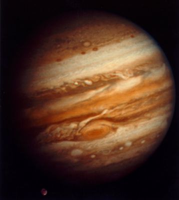 Jupiter, in true colors
The spacecrafts are traveling at a distance where the Sun is but a bright point of light and solar energy is not an option for electrical power. 
The Voyagers owe their longevity to their nuclear power sources - known as Radioisotope Thermoelectric Generators, provided by the Department of Energy. 

Voyager 1 is now at the outer edge of our Solar System, in an area called "The Heliosheath", such as the zone where the Sun's influence wanes. This region is the outer layer of the 'bubble' surrounding the Sun, and no one knows how big this bubble actually is. Voyager 1 is literally venturing into the great unknown and is approaching interstellar space. 
Traveling at a speed of about 1,6 MKM per day (!), Voyager 1 could cross into interstellar space within the next 10 years. 
Parole chiave: Jupiter
