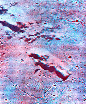Tobias Mayer Crater, from Lunar Orbiter 5 (3D)
Original caption:"Stereoscopic view of an area sw of the Crater Tobias Mayer in Oceanus Procellarum. The highland ridge in the middle portion of the anaglyph is about 35 Km long and 2 Km high. A smooth mare dome abuts the western flank of the ridge. The dome is about 20 Km in diameter and exhibits an elongate summit crater, about 5 Km long. 
A sinuous rille meanders across the lower part of the photograph, detouring around the base of the dome. Note the presence of several crater chains in the lower half and a large highland mass at upper left".
Parole chiave: Moon from orbit - Tobias Mayer Crater