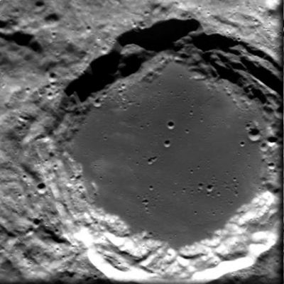 Lomonosov Crater
Caption ESA originale:"This image, taken by the Advanced Moon Imaging Experiment (AMIE) on board ESA’s SMART-1 spacecraft, shows crater Lomonosov, on the Moon’s Far (or "Dark") Side. 
AMIE obtained the image on 30 January 2006 from a distance of about 2100 Km from the surface, with a ground resolution of 190 mt per pixel. The imaged area is centred at a Latitude of 27,8º North and a Longitude of 98,6º East. 

Crater Lomonosov is a nice example for a large crater (92 Km of diameter) which was filled by lava after the impact, thus exhibiting a flat floor. The terraced walls indicate 'slumping', that is sliding of the rocks downwards due to gravity after the end of the impact. The small craters inside Lomonosov are the result of impacts into this lava floor which happened after the formation of Lomonosov".
Parole chiave: The Moon from orbit - Craters - Lomonosov