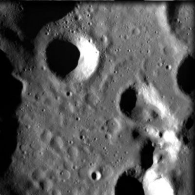 Jacobi Crater (HR)
This HR image was taken by the advanced Moon Imaging Experiment (AMIE) on 18 March 2006 from a distance of about 578 Km from the Moon's surface, with a ground resolution of 52 mt per pixel.  It shows part of crater Jacobi in the Moon's Southern Hemisphere. The western crater rim can be seen on the left edge of the image. The imaged area is centred at a Latitude of 56,5° South and a Longitude of 10,9° East, with a field of view of 27 Km. North is up. 
Crater Jacobi itself is much larger than this image - 68 Km in diameter - with the imaged area only showing about 1/5th of the crater floor area.  The crater is centred at a Latitude of 56,7° South and a Longitude of 11,4° East.  The single prominent crater to the upper left of the image centre is Jacobi "W", with a diameter of only 7 Km. 
Peculiar surface structure can be seen in the lower left part of the image, and indicates several heavily eroded big-sized craters. 
SMART-1 resolution at high solar elevation angle allows for the detection of eroded structures buried under more recent layers, giving a window on the past evolution of the Moon. 

The crater is named after the German mathematician Karl Gustav Jacob Jacobi (1804 - 1851), who worked on elliptic functions and was active in the field of celestial mechanics

Parole chiave: The Moon from orbit - Craters - Jacobi