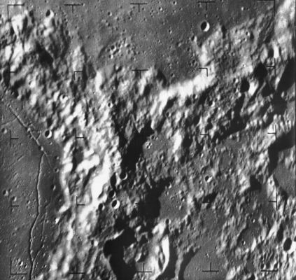 The rim of Alphonsus and Ptolemaeus Crater
Caption NASA originale:"Ranger 9 camera B image of the northeast rim of Alphonsus Crater at left and southern rim of Ptolemaeus crater at the top. The image was taken from 700 Km distance about 4,5 minutes before impact in Alphonsus Crater. The intersecting crater rims exhibit a chaotic, mountainous terrain, in sharp contrast to the flat crater floors. The frame is approximately 120 Km across and North is at 12:30. The image is centered at 12° S, 1° W (Ranger 9, B035)".

Location & Time Information
Date/Time (UT): 1965-02-20 T 14:03:48
Distance/Range (km): 703.10
Central Latitude/Longitude (deg): -12.02, 000.76 W 
Orbit(s): Impact - Hard Landing
Parole chiave: The Moon