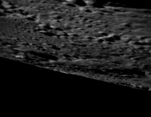 Going Down
Caption ESA originale:"This image of the Lunar Surface was taken on 25 August at 10:08 CEST (08:15 UT) by the star tracker (attitude camera) on board ESA’s SMART-1, from a distance of 59 Km above the Moon Surface. The spacecraft was travelling at a speed of 2 Km/sec. 
The image is slightly smeared as the spacecraft is moving at high speed and at low altitude. This image was taken as a test, meaning that the spacecraft pointing was not optimised for star tracker imaging. 
The Moon features on the photo still have to be identified".
Parole chiave: The Moon from orbit - Chaos Terrain
