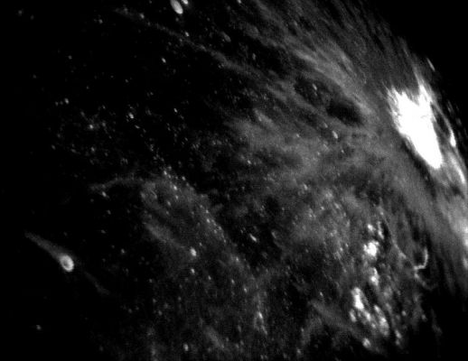 Bright Impact Crater
Caption ESA originale:"Screen shot showing a remarkable impact crater (bright circle at top right) and the elongated shapes of ejected material extending radially outward. 
Animation sequence captured from SMART-1 star tracker on 1 September 2006, 600 Km above the Moon's surface".
Parole chiave: The Moon from orbit - Craters - Unnamed Crater