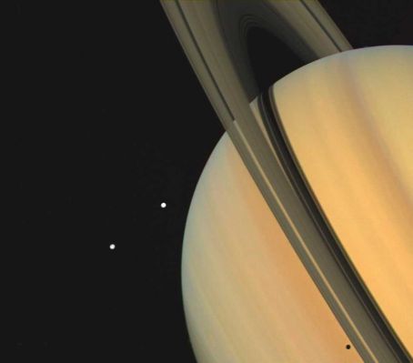 Saturn, Tethys and Dione in almost true colors
Saturn Data and Statistics 
Mass (kg) = 5.688e+26 
Mass (Earth = 1) = 9,5181e+01 
Equatorial radius = 60.268 Km
Equatorial radius (Earth = 1) = 9,4494e+00 
Mean density (gm/cm^3) = 0,69 
Mean distance from the Sun = 1.429.400.000 Km
Mean distance from the Sun (Earth = 1) = 9,5388 
Rotational period (hours) = 10,233 
Orbital period (years) = 29,458 
Mean orbital velocity = 9,67 Km per second
Tilt of axis = 25,33° 
Orbital inclination = 2,488°
Equatorial surface gravity (m/sec^2) = 9,05 
Equatorial escape velocity = 35,49 Km per second
Magnitude (Vo) = 0,67 
Mean cloud temperature = - 125°C 
Atmospheric pressure (bars) = 1,4 
Atmospheric composition: Hydrogen 97% and Helium 3% 
Parole chiave: Saturn and Companions