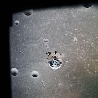 AS 11-37-5445 - Undocking (3) - Taruntius and Dorsum Cayeux (HR)
Original caption:"CSM Columbia over Craters Taruntius "K", Taruntius "P", and Dorsum Cayeux (in Mare Fecunditatis). 
Partially visible are craters Anvil and Taruntius "H".
Parole chiave: The Moon from orbit - Craters (Taruntius)