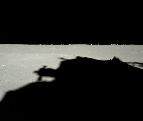 AS 11-40-5854 - A long, dark shadow... (HR)
Original caption:"Looking down-Sun along the LM shadow with boulders on the local horizon. It is interesting to compare this frame with other similar views from the LM window. 
Note that a local ridge obscures the horizon crater rim".

Parole chiave: Lunar Horizon