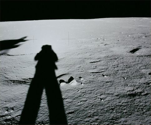 AS 12-46-6731 - The larger "Mound" (HR)
Original caption:"Rightward of AS 46-6730. Down-Sun view. The larger of the 2 mounds that Conrad and Bean will investigate after deploying the ALSEP is visible at the right side just below the local horizon. (...) The large mound is about 22° North-West, as seen from the LM. At the time Conrad took this picture (about 12:44 GMT on November 19, 1969), the Sun was almost exactly East of the spacecraft and at an elevation of 7,6°. The Northern rim of Head Crater is on a line about halfway between the tip of Conrad's shadow and the mound. (...). 
Scan courtesy NASA Johnson SC".
Parole chiave: Lunar Surface - Horizon, Mound and Shadows