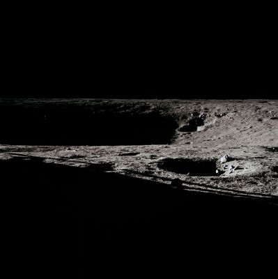 AS 12-46-6741 - The "Eastern Wall" of Surveyor Crater (1)
Frame from Pete Conrad's 12 o'clock pan showing the deep shadow on the eastern wall of Surveyor Crater and, as indicated in a detail, the sunlit solar panels on the Surveyor III spacecraft on the left. Compare with the corresponding frames from Pete's 4 o'clock pan, AS 12-46-6746 and his 8 o'clock pan, AS 12-46-6769. The body and legs of the Surveyor are in shadow. Note the two overlapping craters on the sunlit, southeast inner wall of Surveyor Crater. Note, also, the blocky rimmed crater just outside the LM shadow in the foreground. These blocks may be ejecta from Surveyor Crater which was buried by regolith sprayed onto the site by other impacts and was then brought back to the surface for a second time (at least) by the impact that made the small crater.
Parole chiave: Moon Panorama