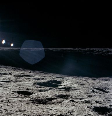AS 12-46-6769 - The "Eastern Wall" of Surveyor Crater
Frame from Pete's 8 o'clock pan showing the deep shadow on the eastern wall of Surveyor Crater and, as indicated in a detail, the sunlit solar panels of Surveyor III. Compare with the corresponding frames from Pete's 12 o'clock pan, AS 12-46-6741 and his 4 o'clock pan, AS12-46-6746. 
Parole chiave: Moon Panorama