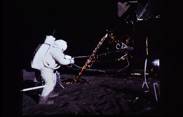 AS 12-46-6786 - The RTG Package
Caption NASA originale:"At about 116:40:44 (MCT-->Mission Clock Time), Al is pivoting the RTG fuel cask into the horizontal position. The graphite-lined cask contains a plutonium fuel element and was designed to protect the element in the event of a launch abort and re-entry. Once he has the cask lowered, Al will use a special tool to remove the protective dome on the cask and then to remove the fuel element for placement in the RTG. Note that the SEQ bay doors are closed. The object just beyond Al is the Handtool Carrier which he took out of the SEQ bay after the RTG package".
Parole chiave: Lunar equipment - RTG