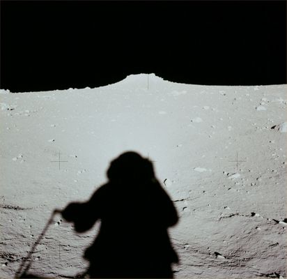 AS 12-46-6793 - The "Larger Mound" (HR)
Original caption:"At about 116:55:53 MT, Pete Conrad took this down-Sun of the larger of the two mounds near the ALSEP deployment site. 
We can see in Pete's shadow that he is using a UHT to carry the SIDE subpallet".
Parole chiave: Lunar Surface - Boulder and Astronaut's Shadow