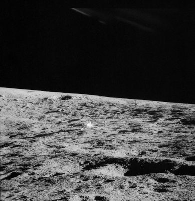 AS 12-48-7084 - Surveyor III on the inner slope of Surveyor Crater
View of the Surveyor III spacecraft from the rest stop on the inner slope of Surveyor Crater. Block Crater is near the Surveyor Crater rim above and to the left of the Surveyor. Al Bean took this picture with Pete's camera, but with the magazine salvaged from his own camera. The pair of rocks between the Surveyor and Block Crater were the key to Ewan Whitaker's identification of this crater in a Lunar Orbiter photo of the area. 
Da aggiungere, al commento originale NASA, una possibile Anomalia: notate, sul margine superiore del frame, quasi perpendicolarmente a Surveyor III, dei curiosi riflessi luminosi. Potrebbero essere un effetto prismatico come potrebbero anche essere l'indicazione di un fenomeno diverso. Purtroppo questa è l'immagine migliore che abbiamo...
Parole chiave: Postcards from the Moon