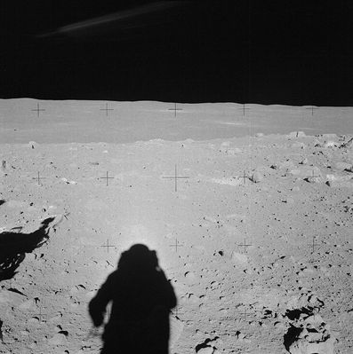 AS 14-64-9098 - Rocks, boulders and a distant LM
Original caption:"Al takes an excellent pan at Station C-Prime, starting with this down-Sun. The LM is at the left, just above the center line. Al and Ed are in the midst of a field of small boulders. 
As we now know, they are about 75 mt South-East of the Southern Rim of Cone Crater. 
Note the split boulder at the right edge of the photograph".
Parole chiave: Lunar Panorama