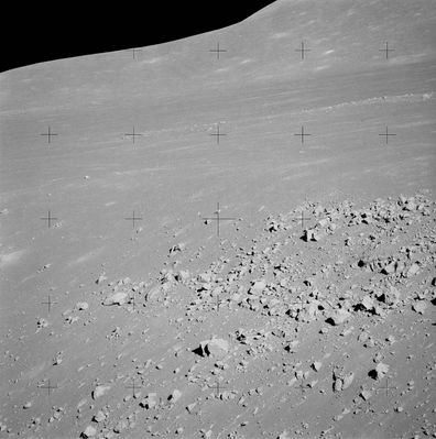 AS 15-84-11257 - Layering?
Original caption:"123:19:35 MT. Rightward from AS 84-11256 with good overlap. Note the apparent layering in the formation just below center on the right. The mare surface is believed to have been built up in a series of relatively thin lava flows with some impact 'weathering' of each fresh surface before the next flow. A cross-section would show a series of thin, horizontal layers". 
Parole chiave: Lunar Surface - possible layering