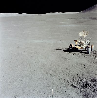 AS 15-86-11618 - The Lunar Rover and the North Complex
Caption NASA originale:"At the site of their second sample site above the Station 6 crater, Dave took this "locator" to the Rover, with the North Complex in the background. The small, fresh crater with fragmental debris on its rim - probably soil compacted in the impact and, therefore, called regolith breccia or instant rock - is also visible in AS-86-11617". 
Parole chiave: LR