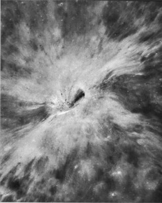 AS 17-2744 - Crater's "Rays"
This is an oblique view of another crater that probably was formed by a meteoroid following a relatively low-angle trajectory. This crater, 4 Km in diameter, is located in the highlands East of Mare Serenitatis. Compared to the crater described in AS 15-9524, this one is less elliptical and its bilobate ray pattern is much less pronounced. The differences may be attributed to a higher trajectory angle of the impacting body that formed this crater as it struck the surface. 
H. J. Moore (1976), in his study of craters formed by impacting missiles at White Sands Missile Range, recognized a characteristic asymmetric profile along the axis of trajectory for craters formed in this manner. 
The wall beneath the missile trajectory is typically less steep than the opposite or down-trajectory wall, and its rim crest is lower and more rounded. These observations, when applied to the lunar crater in this photograph, indicate that the impacting body was traveling toward the East when it struck the Moon.
Parole chiave: The Moon from orbit - Craters - Unnamed Crater