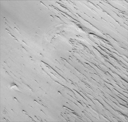 Yardangs in Terra Sabaea (1 - Original NASA/MGS/MSSS b/w Frame)
Caption NASA originale:"This MGS-MOC image shows the contact between a group of Yardangs, tapered Ridges formed by the removal of relatively easily-eroded material (e.g.: Sedimentary Rock) and a concentration of dark-toned windblown Sand on the Floor of an Unnamed Crater in the Terra Sabaea Region of Mars".  

Location near: 1,4° North Lat. and 333,9° West Long.
Image width: ~3 Km (~1,9 mi)  
Illumination from: upper left  
Season: Northern Spring
Parole chiave: Mars from orbit - Aeolian Features - Yardangs in Terra Sabaea