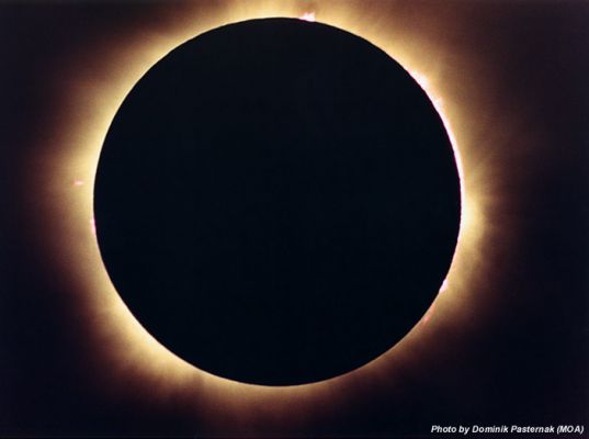 Black Sun
Caption NASA originale:"During a total solar eclipse, Earth's moon blocks the Sun - almost exactly. While the Sun is about 400 times wider than the Moon, it is also about 400 times farther away and each appears to be half a degree or so in diameter. On August 11, 1999 this remarkable coincidence in the apparent size of two vastly different celestial bodies produced tantalizing solar spectacles for denizens of Europe and Asia. For example, prominences along the Sun's limb peer around the Moon's dark edge in this dramatic picture of totality recorded as the lunar shadow swept across Hungary. Subtle structures in the Sun's inner corona are also visible streaming beyond the silhouetted Moon".
Parole chiave: Sun Eclipse
